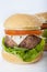 Giant homemade burger classic american cheeseburger isolated on