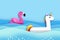 Giant inflatable Fantasy Unisorn and Pink Flamingo paper cut style. Origami Pool float toys. Crystal clear blue sea