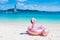 Giant inflatable pink flamingo pool float toy on the tropical be