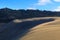 Giant inland sand dune with forest behind, New Zealand