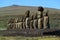 The giant Moai statues of Ahu Tongariki with Poike volcano in background, Archaeological site in Easter Island