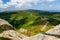 Giant Mountains, mountain panorama from the hiking trail to the top of Sniezka. View of the vast mountain slopes and trails