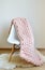 Giant Pink Blanket Woolen Knitted on White Wooden Stool Chair