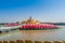 Giant pink lotus on the river with Buddha images in the center at the public Wat Samarn temple, Chachoengsao, Thailand.