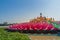 Giant pink lotus on the river with Buddha images in the center at the public Wat Samarn temple, Chachoengsao, Thailand.