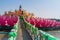 Giant pink lotus on the river with Buddha images in the center at the public Wat Samarn temple, Chachoengsao, Thailand.