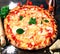 Giant Pizza on wood table with tomatoes and parmisan