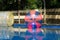 Giant plastic zorbing balloons floating on water in park