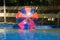 Giant plastic zorbing balloons floating on water in park