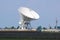 Giant radio telescopes search for extraterrestrial life.