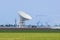 Giant radio telescopes search for extraterrestrial life.