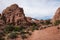 Giant red rock formations inside of Arches National Park. Blue sky and clouds