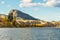 Giant`s Head Mountain and sandstone cliffs viewed across Okanagan Lake in autumn