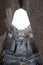 Giant seated Buddha at Wat Si Chum, seen from entrance to assembly hall mondop, Sukhothai Historical Park, Thailand