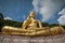 Giant sitting buddha on Rang Hill Temple in Phuket, Thailand