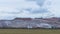 Giant spreader or absetzer machinery. A large dumper on a landfill with potash ore. Extracting potassium salts.