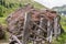 Giant stone boulder on a pasture and destroyed wooden fence, Austria