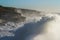 Giant storm seas crash into cliffs