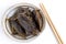 Giant Water Bug is edible insect for eating as food Insects deep-fried crispy snack on plate and chopsticks on white background,