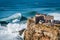 Giant Waves Crashing Near the Fort of Sao Miguel Arcanjo Lighthouse in Nazare, Portugal