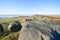 Giant weathered gritstone boulders cover the top of Stanage Edge in Derbyshire.