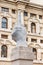 Giant white marble hand statue with broken fingers by Maurizio Cattelan called L.O.V.E. on Piazza degli Affari square in Milan,