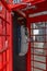 Gibraltar cityscape. Close up of two empty typical English red telephone boxes