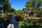 Giethoorn canal and beautiful cottages on shore.