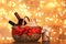 Gift basket with bottles of wine against blurred lights