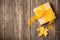 Gift box and autumn maple leaf on wooden background