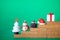 Gift box, cap santa, cake, snowman and Christmas tree on stair step wood block on wood background