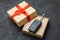 Gift box with car keys with remote control alarm system with red ribbon bow.