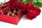 Gift box of chocolate truffles with red roses