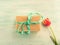 Gift box with green ribbon pastel background