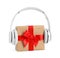 Gift box with headphones isolated. Christmas music concept