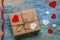 Gift box with hearts and red ribbon