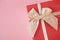 Gift box on an isolated pink background. Rectangular gift box