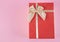 Gift box on an isolated pink background. Rectangular gift box