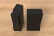 Gift box mock up: two tall and wide black boxes on wooden background.  View above