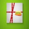 Gift box with red sale tape on green background.