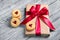 Gift box with satin bow and cookies with marmalade in the shape of heart. A romantic gift.