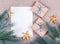 Gift Boxes and blank paper sheet. Christmas decoration background with gifts and fir branches