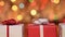 Gift boxes for christmas against blurry lights