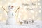 Gift card with a new year and christmas with a picture of a snowman with a sleigh against a backdrop of glowing garlands