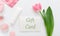 Gift card with pink flower on white background from beauty salon cosmetics perfumery shop. Gift card present coupon for woman.