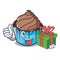 With gift chocolate cupcake mascot cartoon