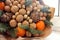Gift Christmas bouquet. Pine cones, oranges, peanuts, walnuts, spruce branch in a beautiful package. Electoral focus. Christmas