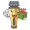 With gift electric shaver isolated with in mascot