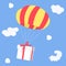 Gift is flying on parachute, delivery coming from the sky