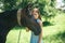 The gift of friendship. Pretty girl at horse ranch. Adorable horse owner with her pet. Making friends with horse